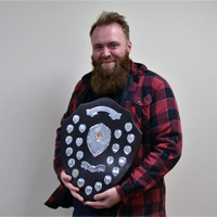 Happy White Bishops team captain with spoils of the season